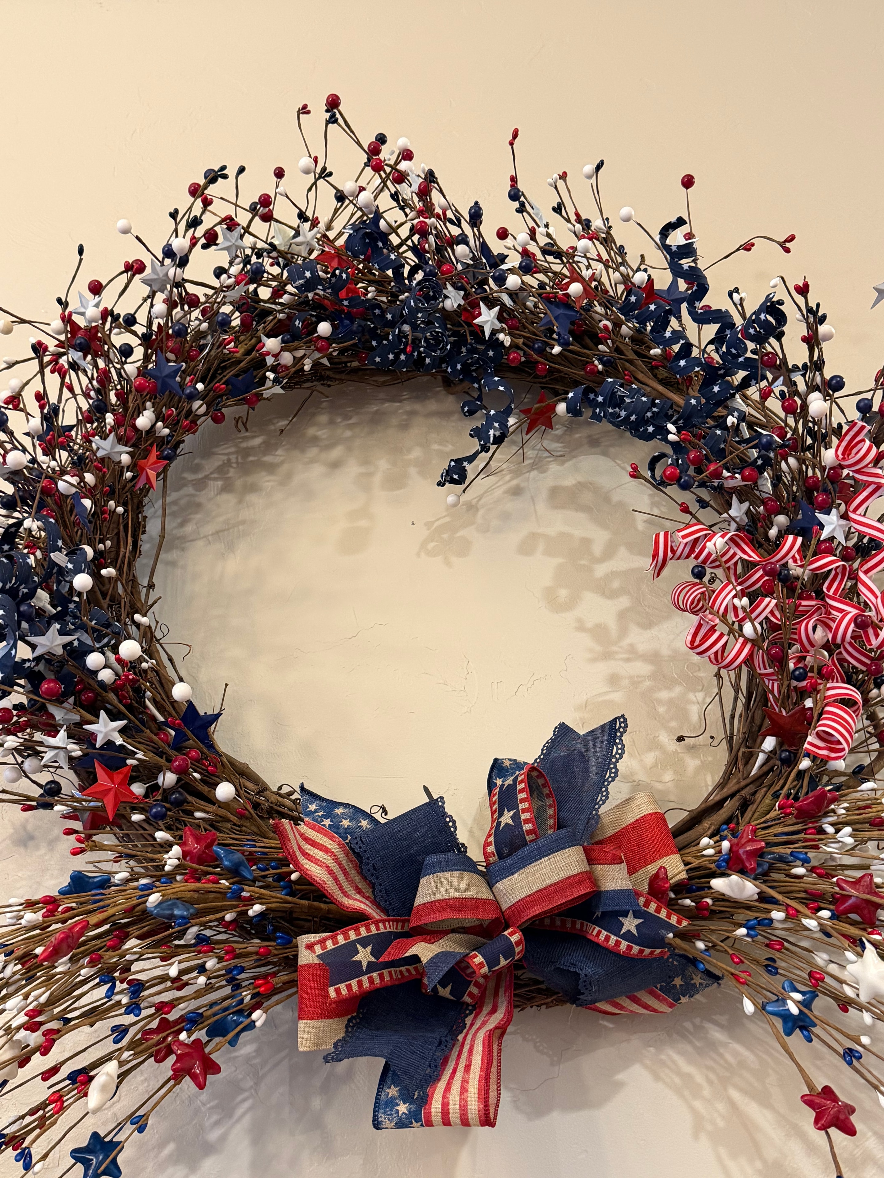 Patriotic wreath with stars and stripes bow