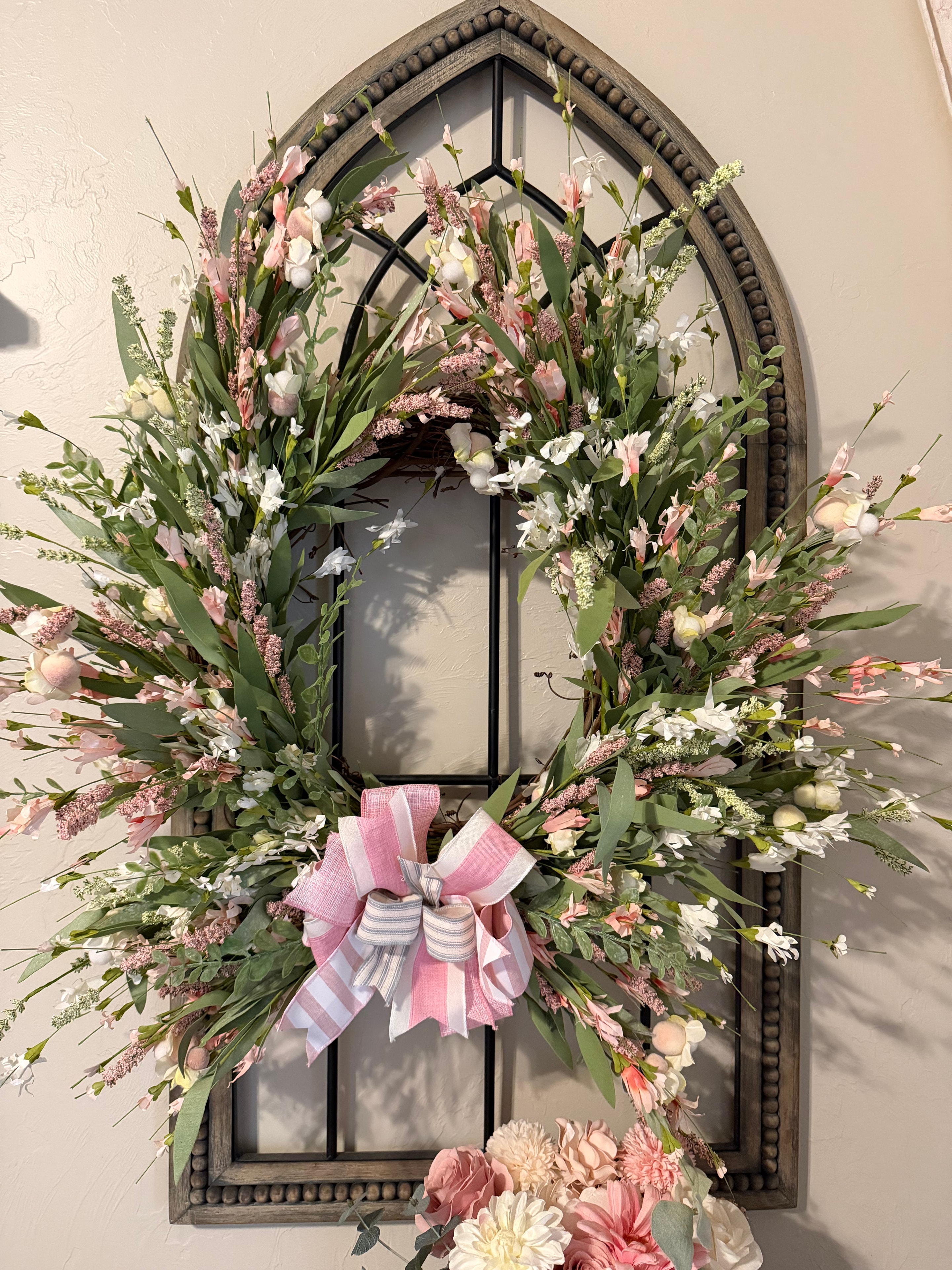 Floral wreath on arched window